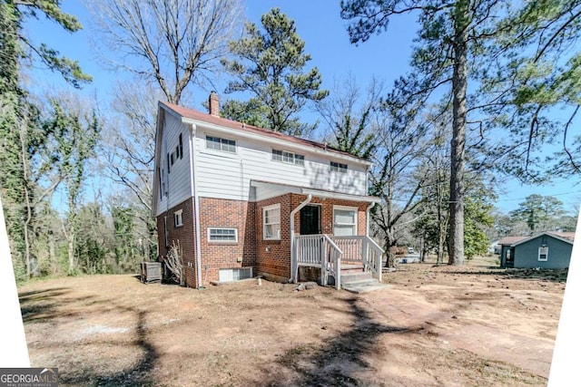 238 Howell Dr SW, Atlanta, GA 30331 - view of front of home with brick siding and a chimney
