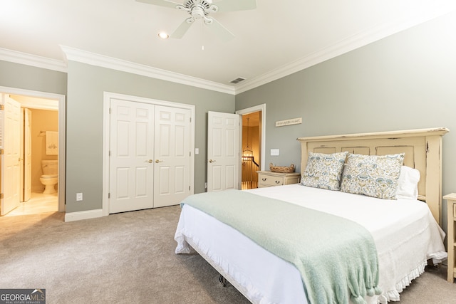 bedroom with crown molding, ceiling fan, baseboards, carpet, and a closet