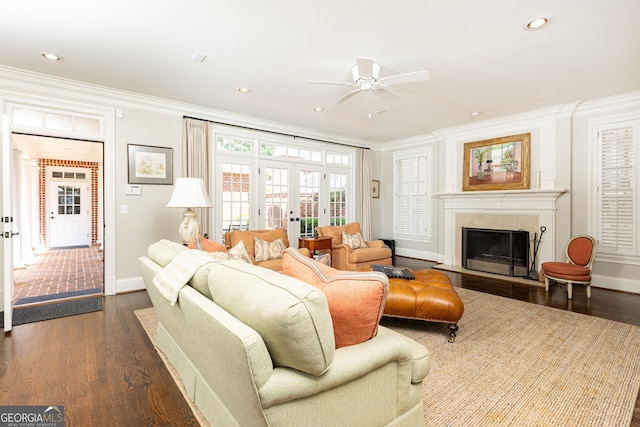 living area featuring french doors, dark wood-style flooring, and ornamental molding