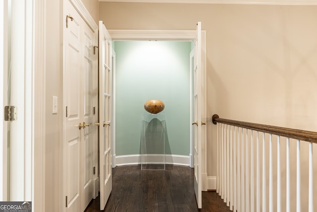 corridor with baseboards and dark wood-style flooring