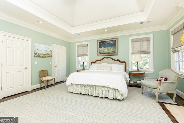 bedroom featuring visible vents, wood finished floors, recessed lighting, crown molding, and baseboards