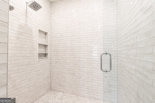 bathroom featuring a shower stall