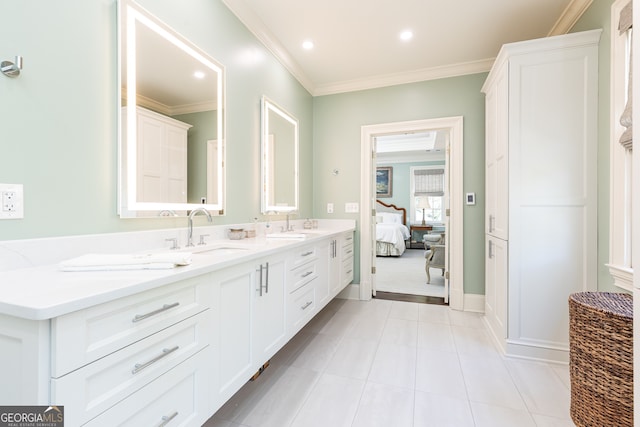 bathroom featuring double vanity, ornamental molding, recessed lighting, tile patterned floors, and a sink