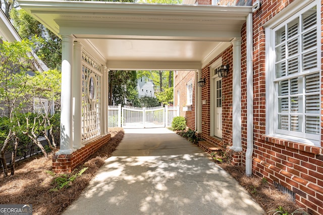 view of patio featuring fence and driveway