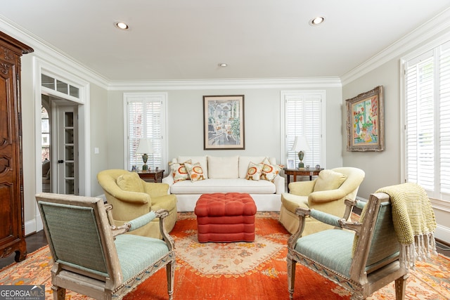 living area featuring recessed lighting, a healthy amount of sunlight, and ornamental molding