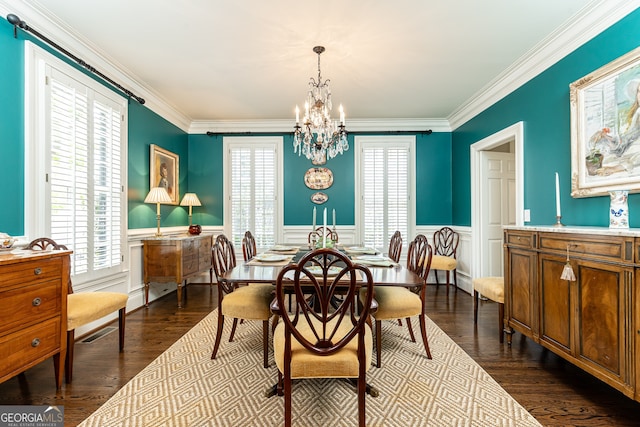 dining room featuring a wainscoted wall, plenty of natural light, and dark wood-style flooring