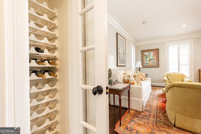 interior space featuring recessed lighting, wood finished floors, and ornamental molding