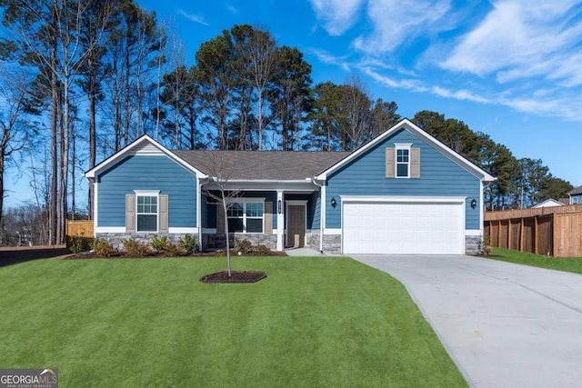 view of front facade featuring driveway, stone siding, fence, and a front lawn