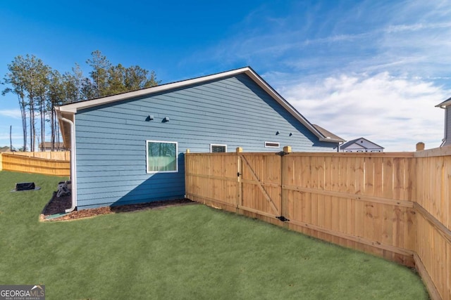 exterior space featuring a yard and fence