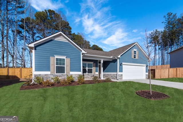 view of front of property featuring driveway, stone siding, fence, and a front lawn