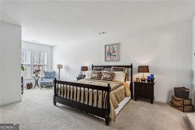 bedroom featuring carpet flooring and baseboards