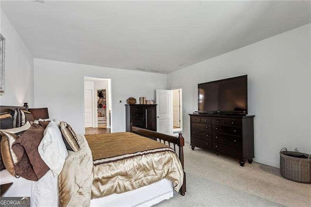 bedroom featuring light carpet