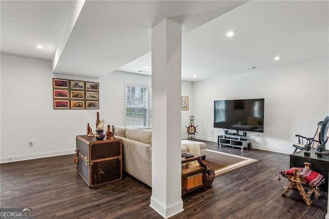 living area with recessed lighting, baseboards, and wood finished floors