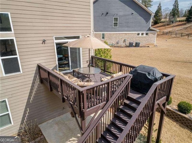 deck with central air condition unit, a grill, stairs, and outdoor dining space