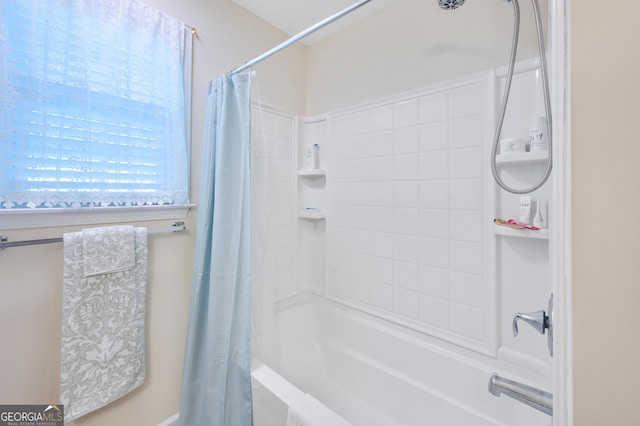 bathroom with shower / bathtub combination with curtain