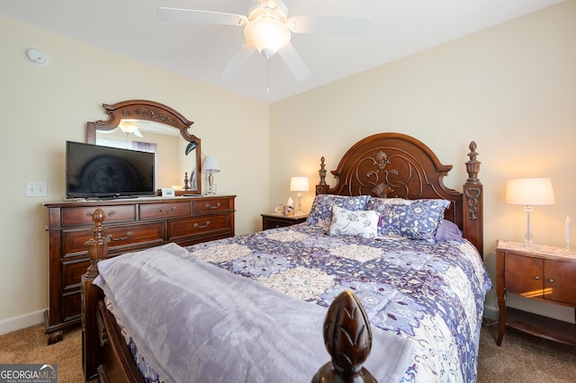 bedroom with a ceiling fan, light carpet, and baseboards