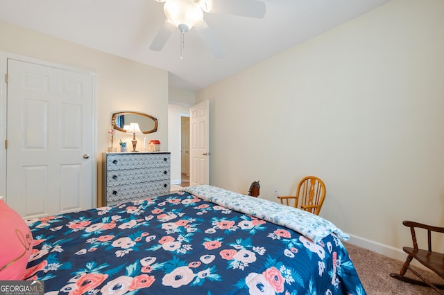 bedroom with ceiling fan, baseboards, and carpet flooring