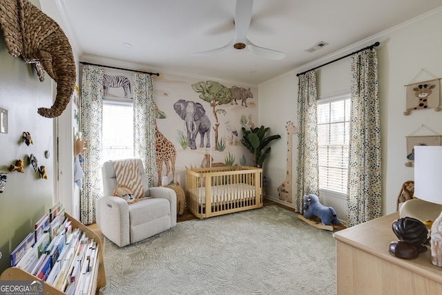 living area with ornamental molding, carpet flooring, and a wealth of natural light