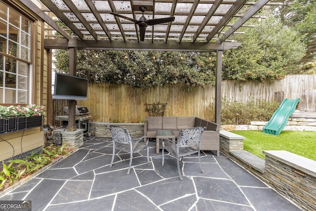 view of patio / terrace with fence, outdoor lounge area, a grill, and a pergola