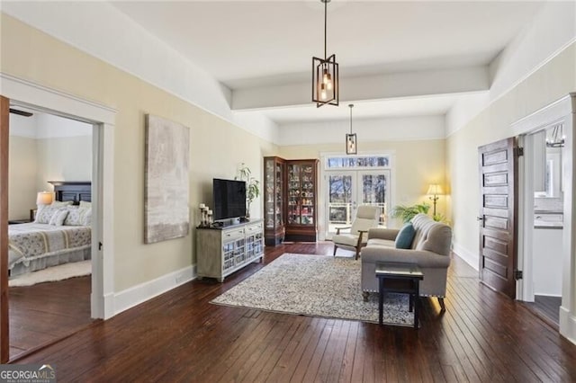 living room featuring dark wood-style floors, baseboards, beam ceiling, and french doors