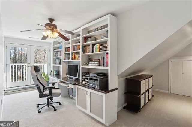 carpeted home office featuring visible vents, a ceiling fan, and french doors