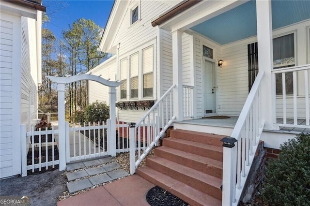 property entrance with covered porch