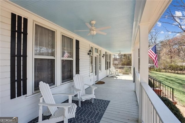 wooden deck featuring ceiling fan and a porch