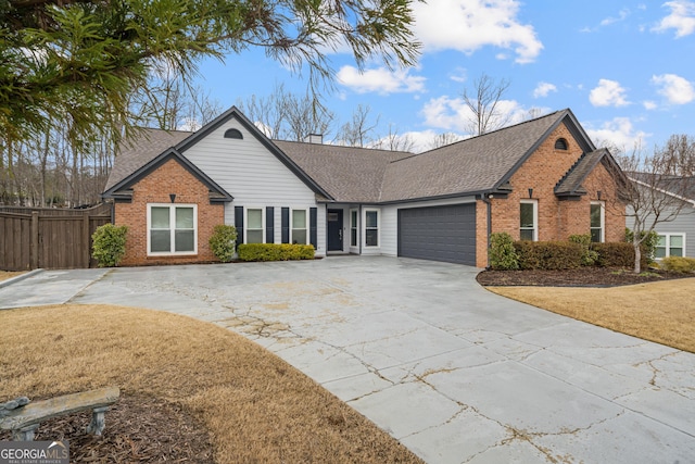 ranch-style house featuring an attached garage, brick siding, a shingled roof, fence, and driveway