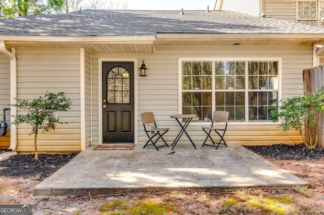 2139 Hickory Bnd SE Unit E, Conyers, GA 30013 - view of exterior entry with a shingled roof and covered porch