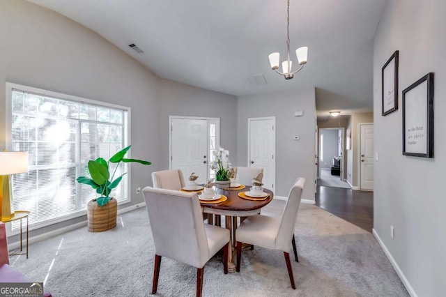 2139 Hickory Bnd SE Unit E, Conyers, GA 30013 - dining area featuring carpet, lofted ceiling, and a chandelier