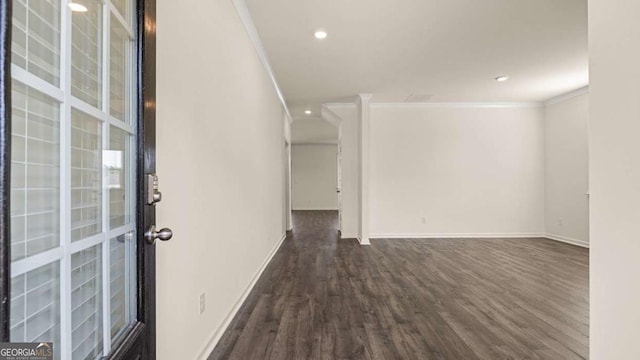 1069 Blue Juniper Cir, Loganville, GA 30052 - empty room featuring baseboards, dark wood-type flooring, crown molding, and recessed lighting