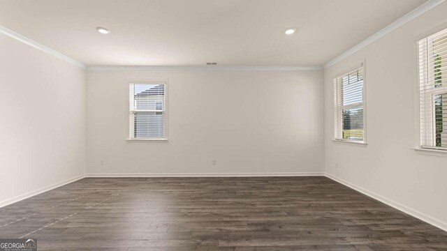 1069 Blue Juniper Cir, Loganville, GA 30052 - empty room featuring ornamental molding, recessed lighting, baseboards, and dark wood-style floors
