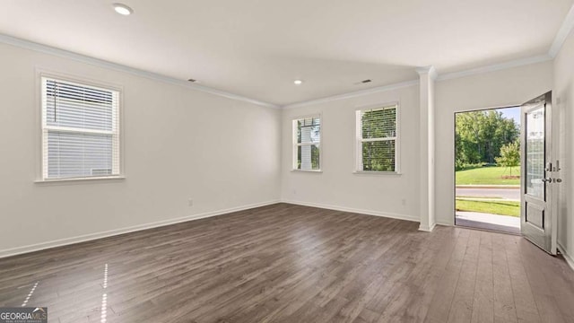 1069 Blue Juniper Cir, Loganville, GA 30052 - spare room featuring baseboards, recessed lighting, dark wood finished floors, and crown molding