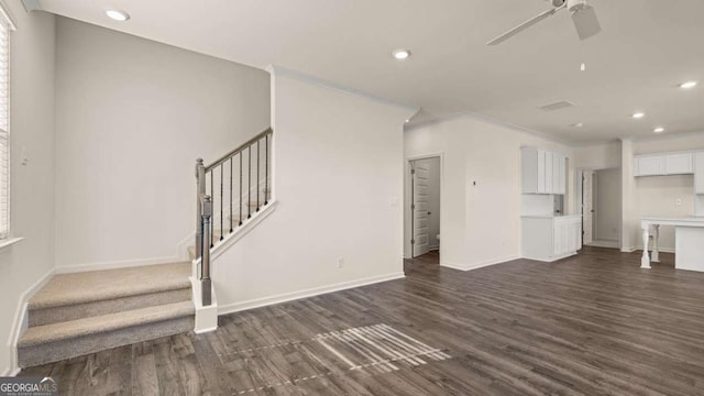 1069 Blue Juniper Cir, Loganville, GA 30052 - unfurnished living room featuring stairs, baseboards, dark wood-type flooring, and recessed lighting