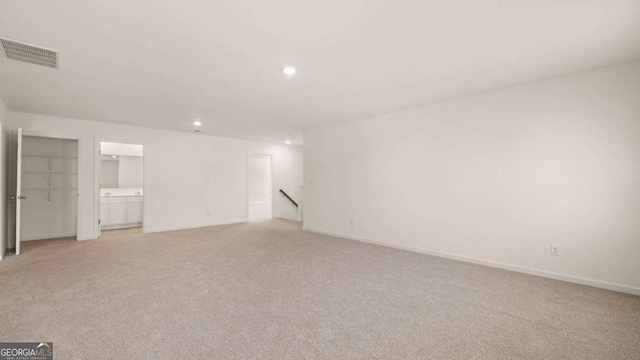 1069 Blue Juniper Cir, Loganville, GA 30052 - interior space featuring baseboards, recessed lighting, visible vents, and light colored carpet