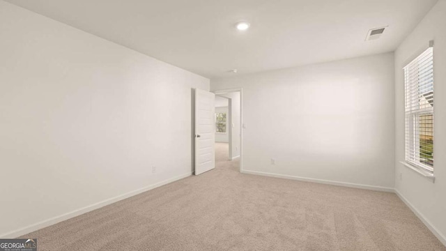 1069 Blue Juniper Cir, Loganville, GA 30052 - unfurnished room with light carpet, visible vents, and baseboards