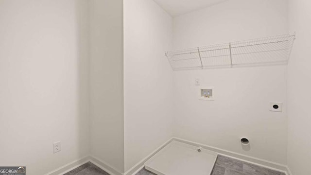 1069 Blue Juniper Cir, Loganville, GA 30052 - laundry area with laundry area, baseboards, hookup for a gas dryer, hookup for a washing machine, and electric dryer hookup