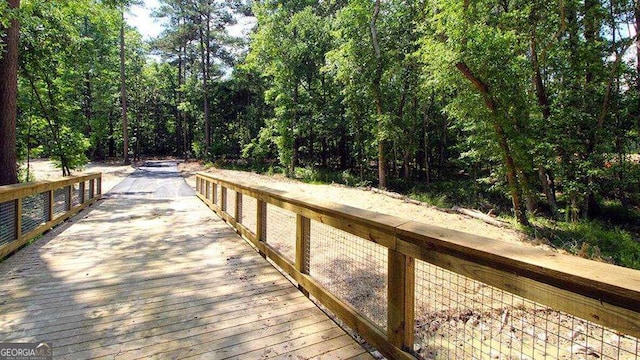 1069 Blue Juniper Cir, Loganville, GA 30052 - view of dock with a forest view