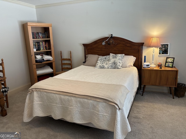 bedroom with ornamental molding, carpet, and baseboards