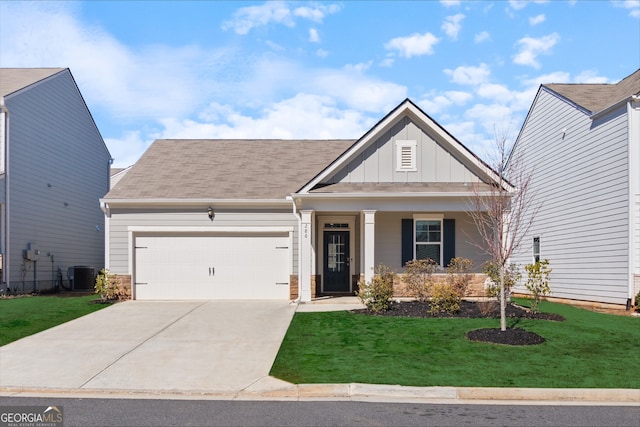 view of front facade featuring an attached garage, cooling unit, driveway, a front lawn, and board and batten siding