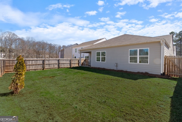 view of yard with a fenced backyard