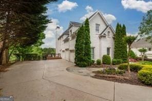 view of home's exterior featuring driveway