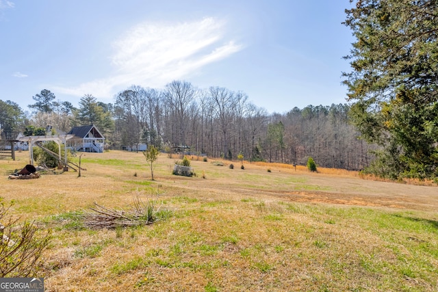 view of yard with a wooded view