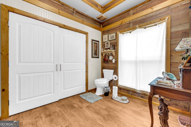 bathroom with wood finished floors and toilet