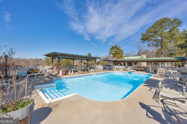 view of pool with a fenced in pool and a patio