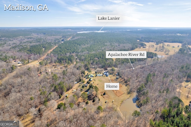 bird's eye view featuring a wooded view