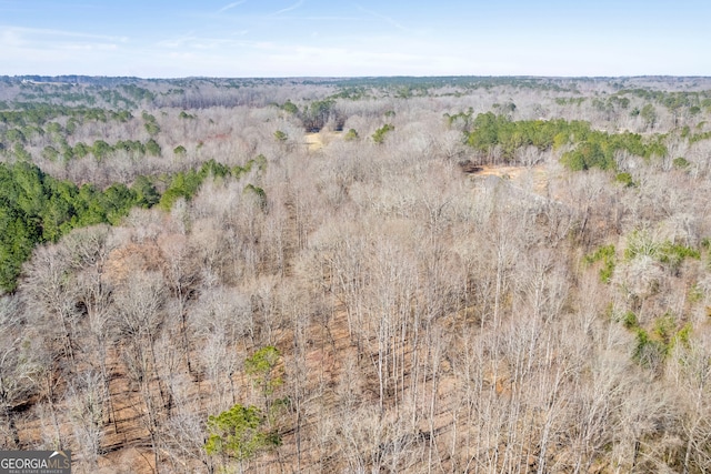 drone / aerial view featuring a view of trees