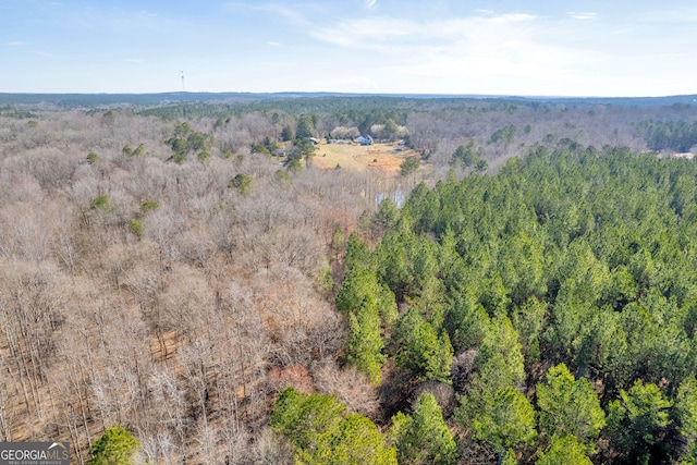 bird's eye view featuring a forest view