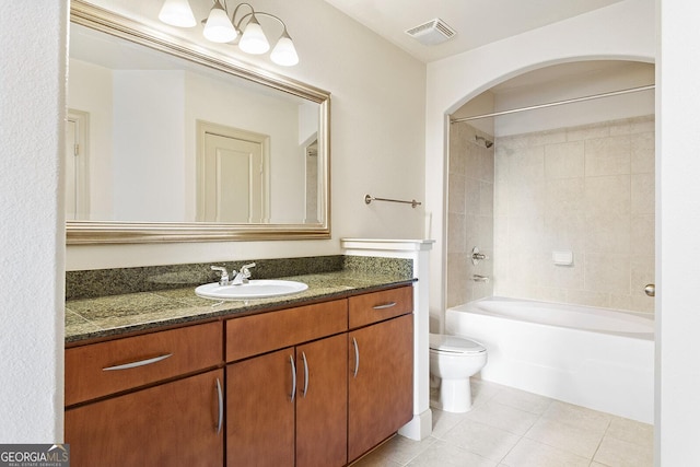 3445 Stratford Rd NE Unit 1605, Atlanta, GA 30326 - bathroom with toilet, tile patterned flooring, vanity, and washtub / shower combination