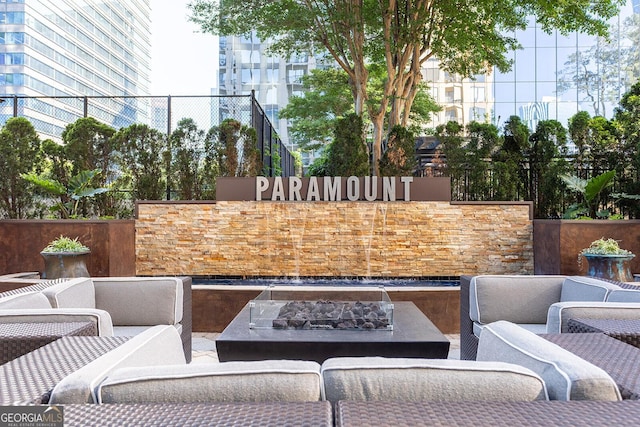 3445 Stratford Rd NE Unit 1605, Atlanta, GA 30326 - view of patio / terrace featuring an outdoor living space with a fire pit